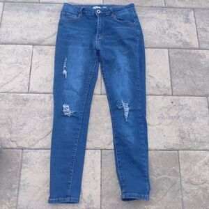 Dark blue wash distress skinny jeans